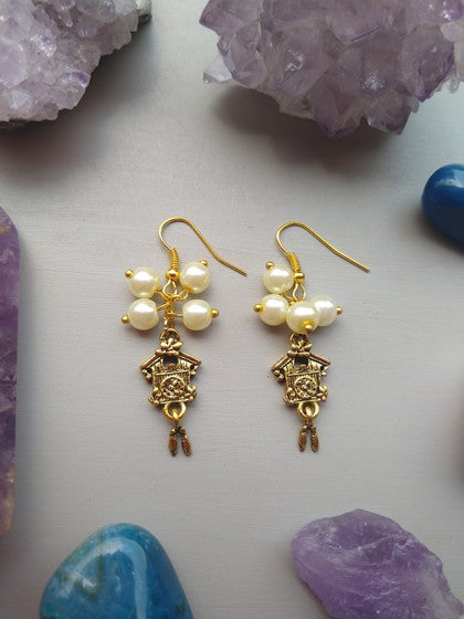 ARETES RELOJ