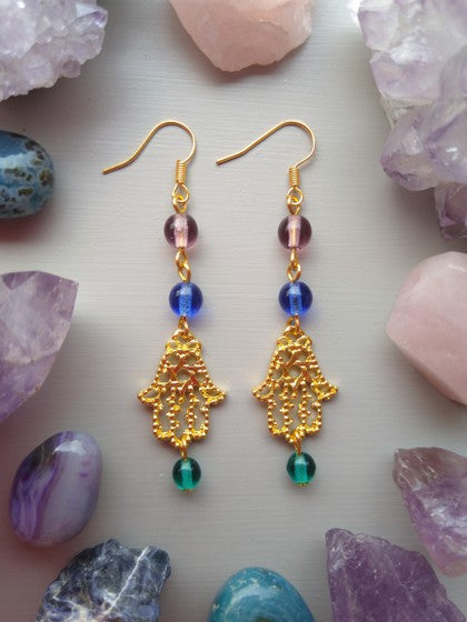 ARETES VERDE, AZUL Y MORADO CON HAMSA