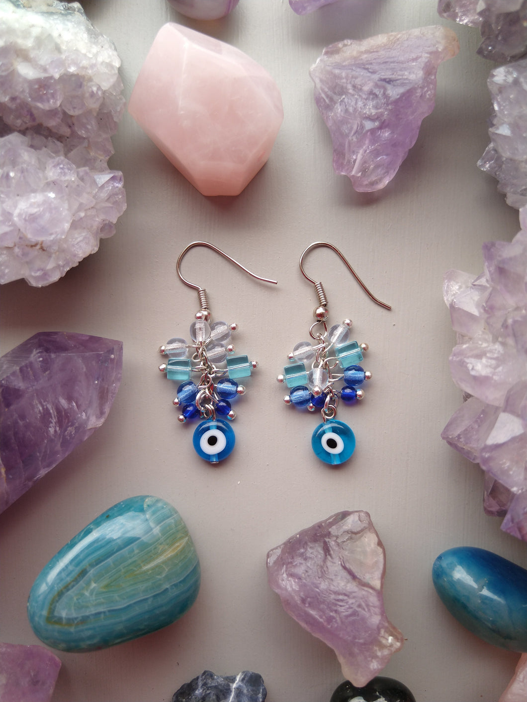 ARETES OJITO CHICO AZUL CLARO