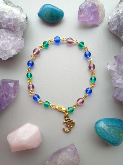 PULSERA AZUL MORADO Y VERDE CON OM