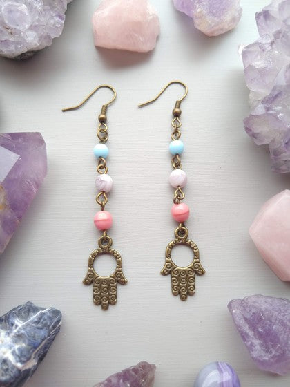 ARETES AZUL, LILA Y ROSA HAMSA